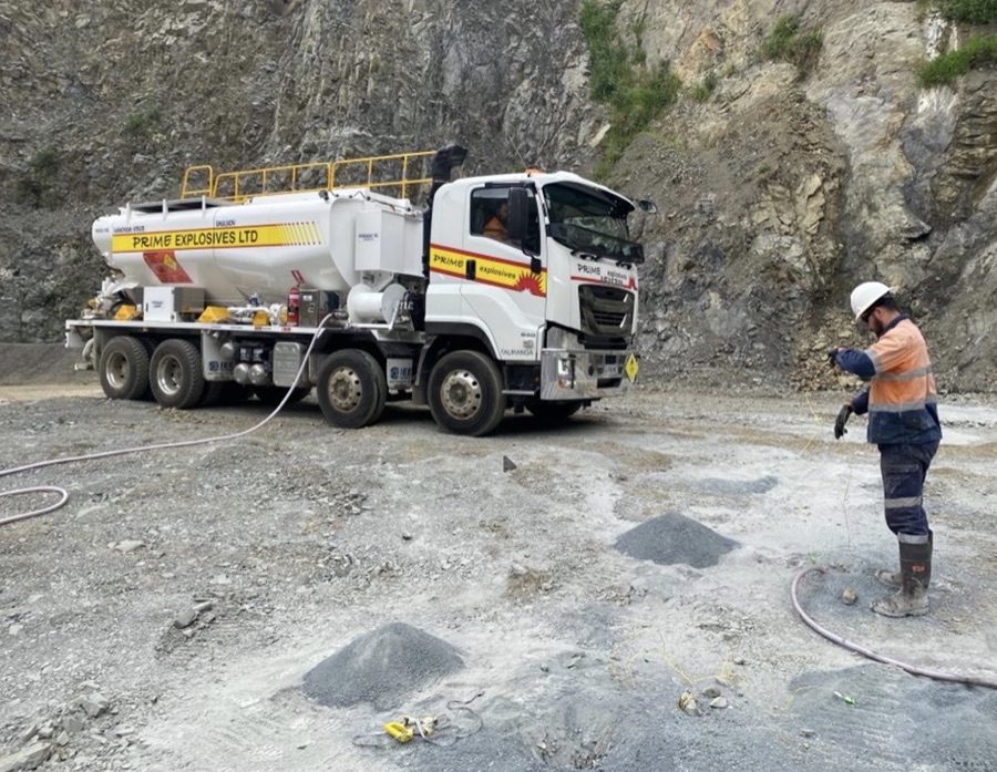Prime Explosives mobile mixing unit charging blast holes at a quarry