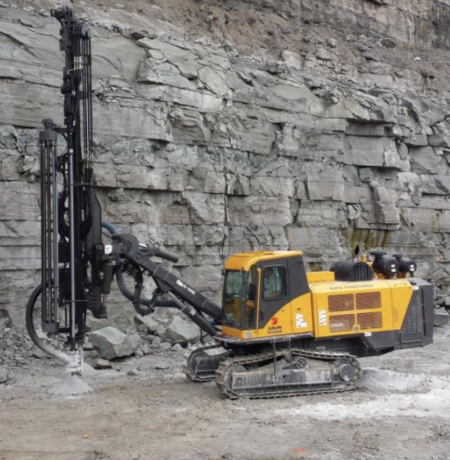 Rock Commander drill rig at a quarry rock face